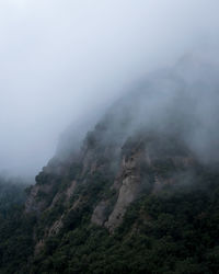 Scenic view of misty mountains. 