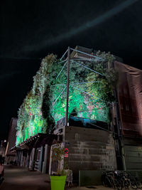 Low angle view of illuminated building at night