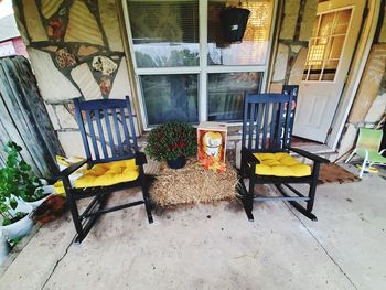 Empty chairs and tables in building