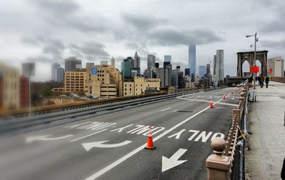 City street against cloudy sky