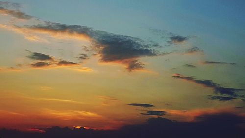 Low angle view of dramatic sky during sunset