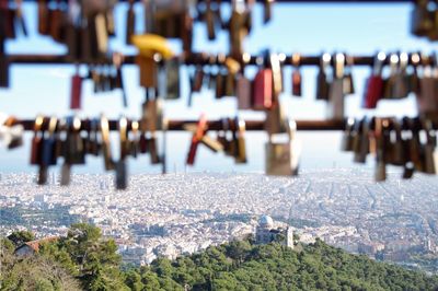 Padlocks hanging on street in city