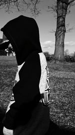 Woman standing on grassy field