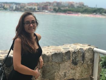 Portrait of smiling young woman outdoors