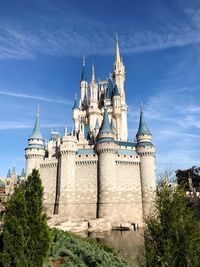 Low angle view of building against blue sky