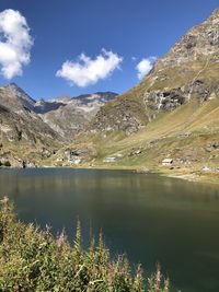 Scenic view of lake and mountains against sky