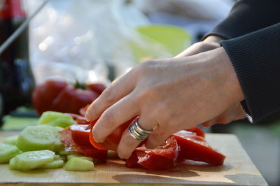 Cropped image of person preparing food