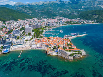 High angle view of townscape by sea