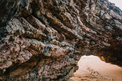 Close-up of rock formation against sky