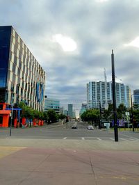 City street against cloudy sky