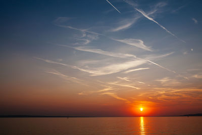 Scenic view of calm sea at sunset