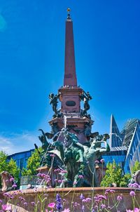 Low angle view of historical building against blue sky