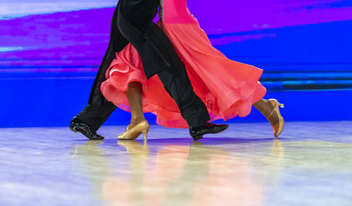 Low section of woman dancing on floor