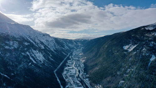 High angle view of snowcapped mountains against sky