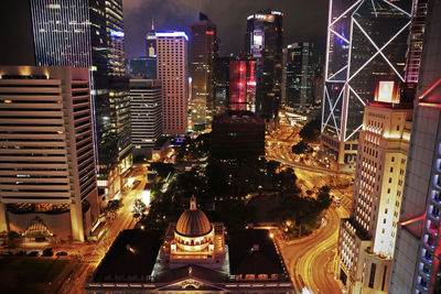 Aerial view of illuminated buildings in city at night