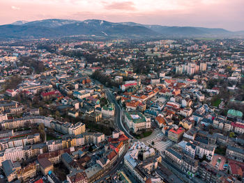 High angle view of city at sunset