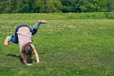 Woman with dog on field