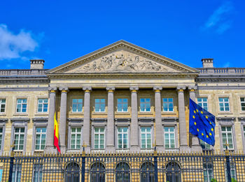 Low angle view of building against blue sky