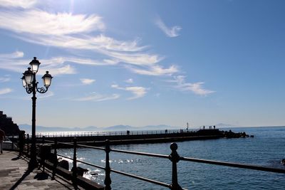 Bridge over sea against sky