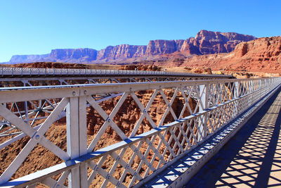 Bridge over river against clear sky