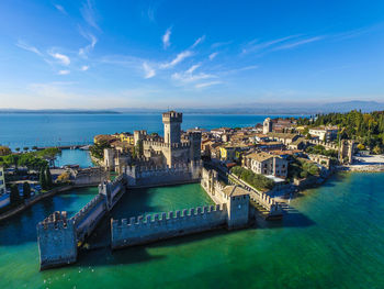 Aerial view of fort in sea against blue sky