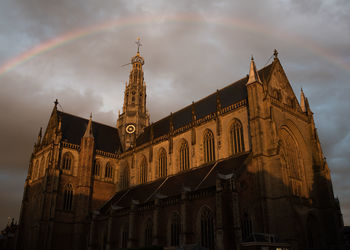 Low angle view of cathedral against cloudy sky