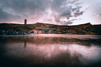 Scenic view of lake against sky during sunset