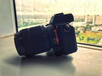 Close-up of camera on window