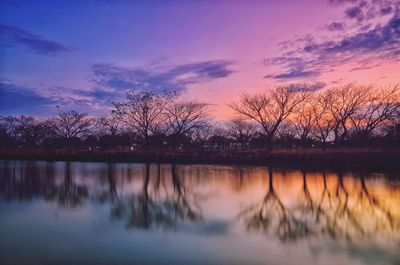 Scenic view of lake against sky during sunset