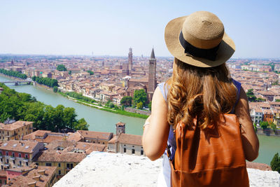 Rear view of woman looking at cityscape