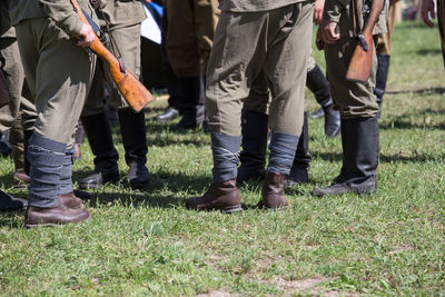 Low section of soldiers standing on land