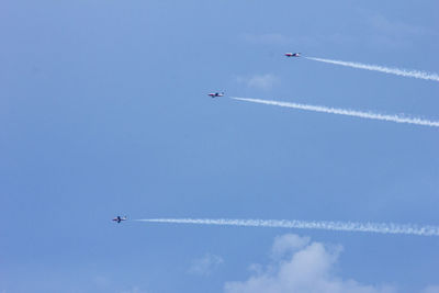 Low angle view of airplane flying in sky