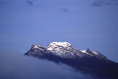 Scenic view of snowcapped mountains against clear sky