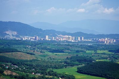 Scenic view of landscape and mountains against sky