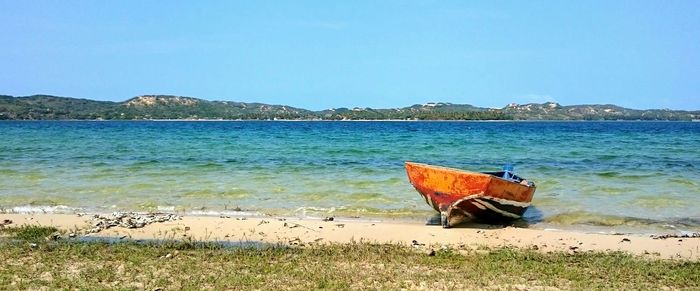 Scenic view of calm sea against clear sky