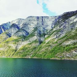 Scenic view of lake against mountain range