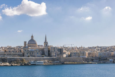 Buildings in city against cloudy sky,panoramic view of city against sky ,malta valletta europe 