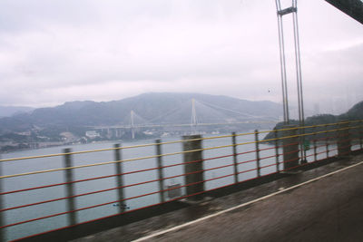 Houses against cloudy sky