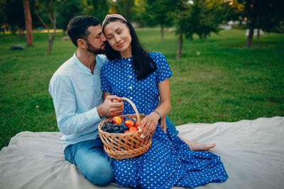 Young couple kissing in basket