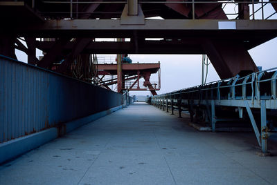 View of bridge over pier against sky