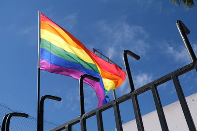 Lgbtq flag on blue sky