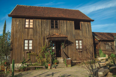 Entrance of charming wooden old house in a traditional rural style, near bento goncalves, brasil.