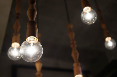 Low angle view of illuminated light bulb