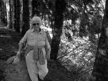 Woman walking in forest