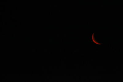 Low angle view of moon against sky at night