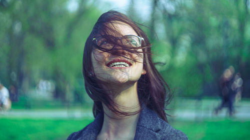 Beautiful smiling young woman looking up