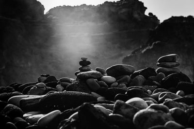 Close-up of pebbles against sky