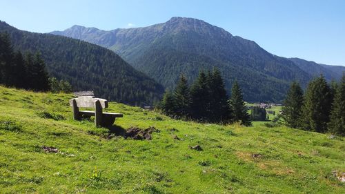 Built structure on countryside landscape against mountain range