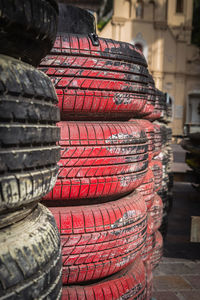 Close-up of red stack against building