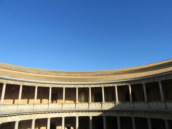 Low angle view of historical building against blue sky